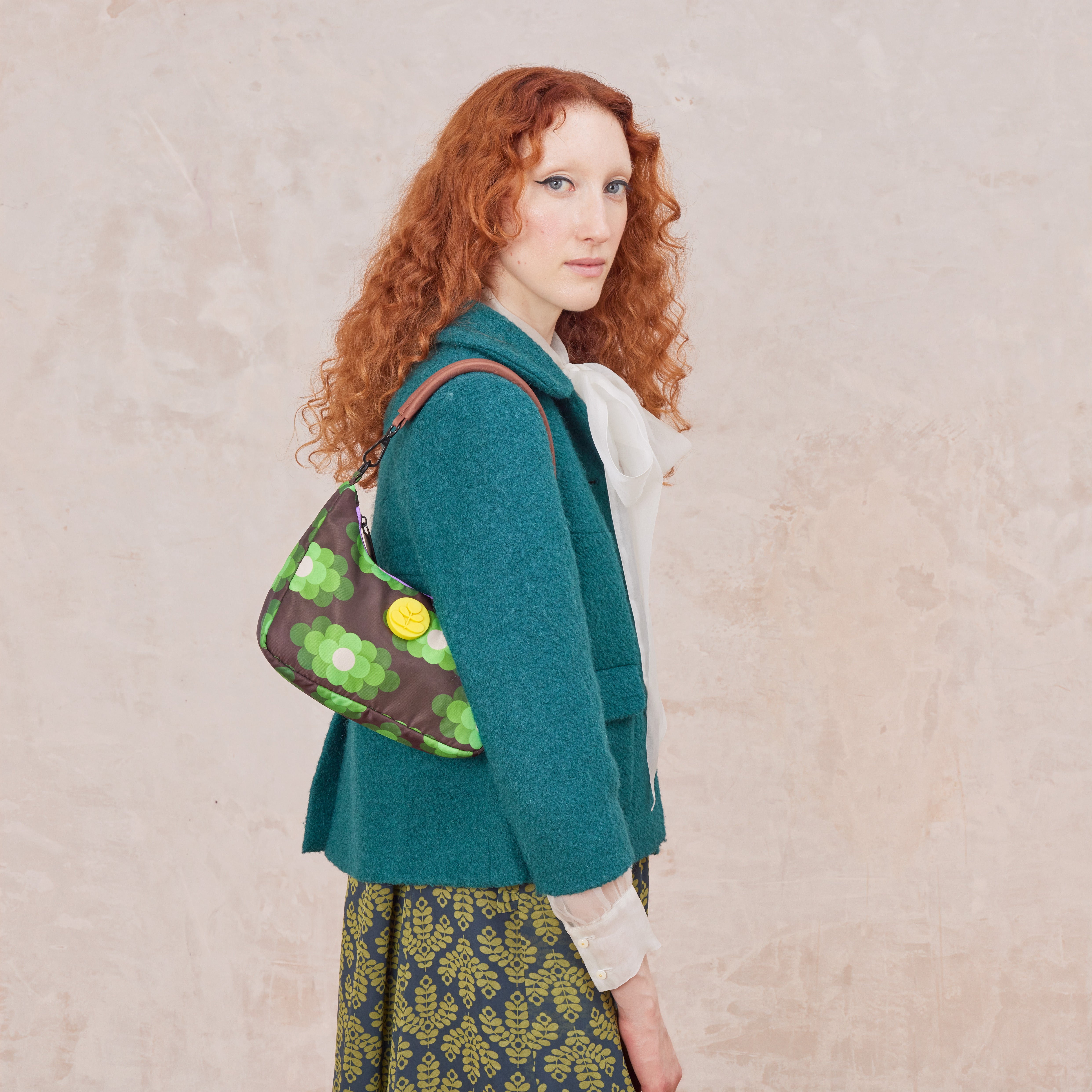 Floral-patterned bag in neon green work over the shoulder