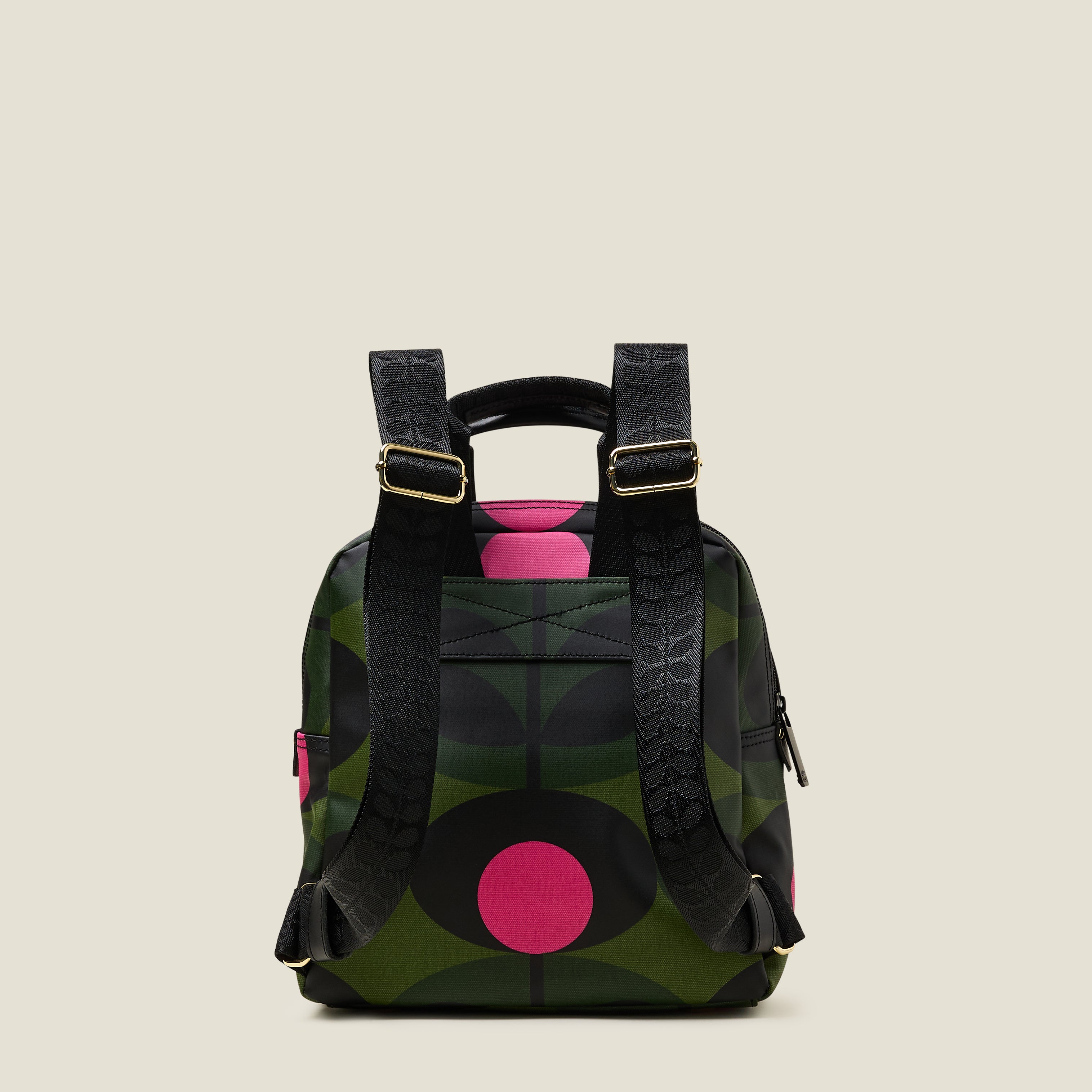 Back view of Mini Lotta Backpack in a green stem print with bright pink dots, featuring branded shoulder straps.