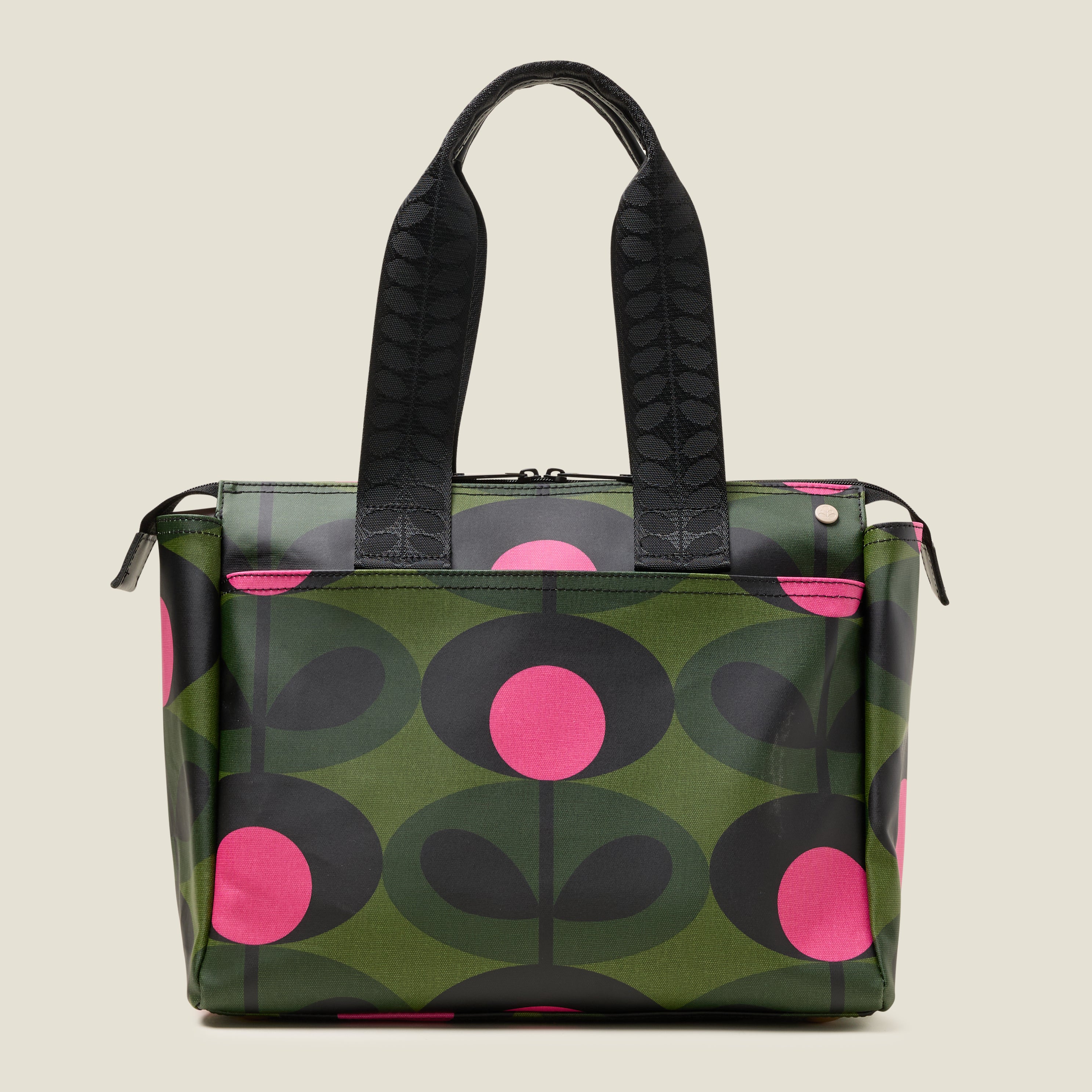 Front view of tote bag with a green and pink stem pattern, featuring a slip pocket.